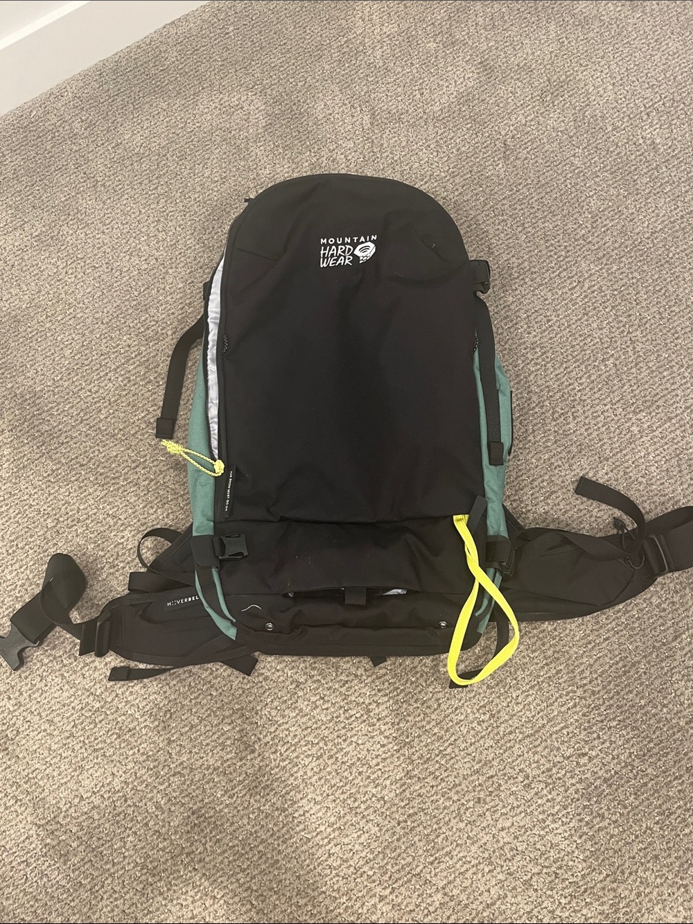 Mountain Hardwear Black Backpack with Teal Panels and Yellow Accents